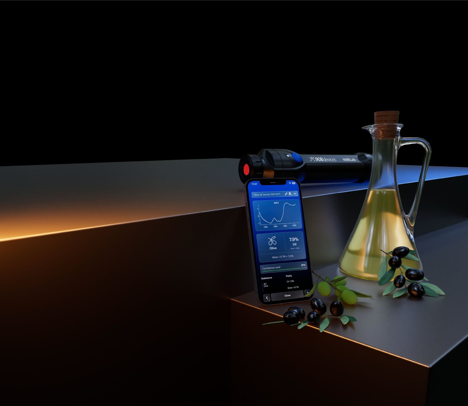Handheld NIR spectrometer beside a carafe of olive oil